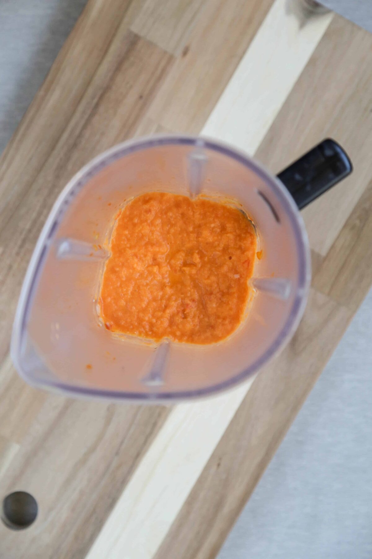 tomato mixture for paella in a blender container.