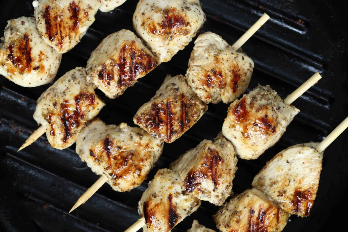 chicken skewers on the grill.