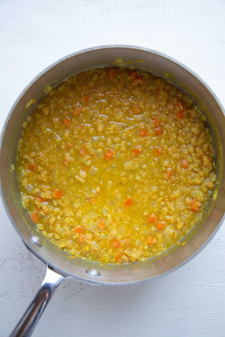 cooked lentil soup in a pot.