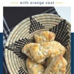 black and wicker basket filled with white chocolate chip scones.