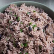 black beans and rice in a green bowl.