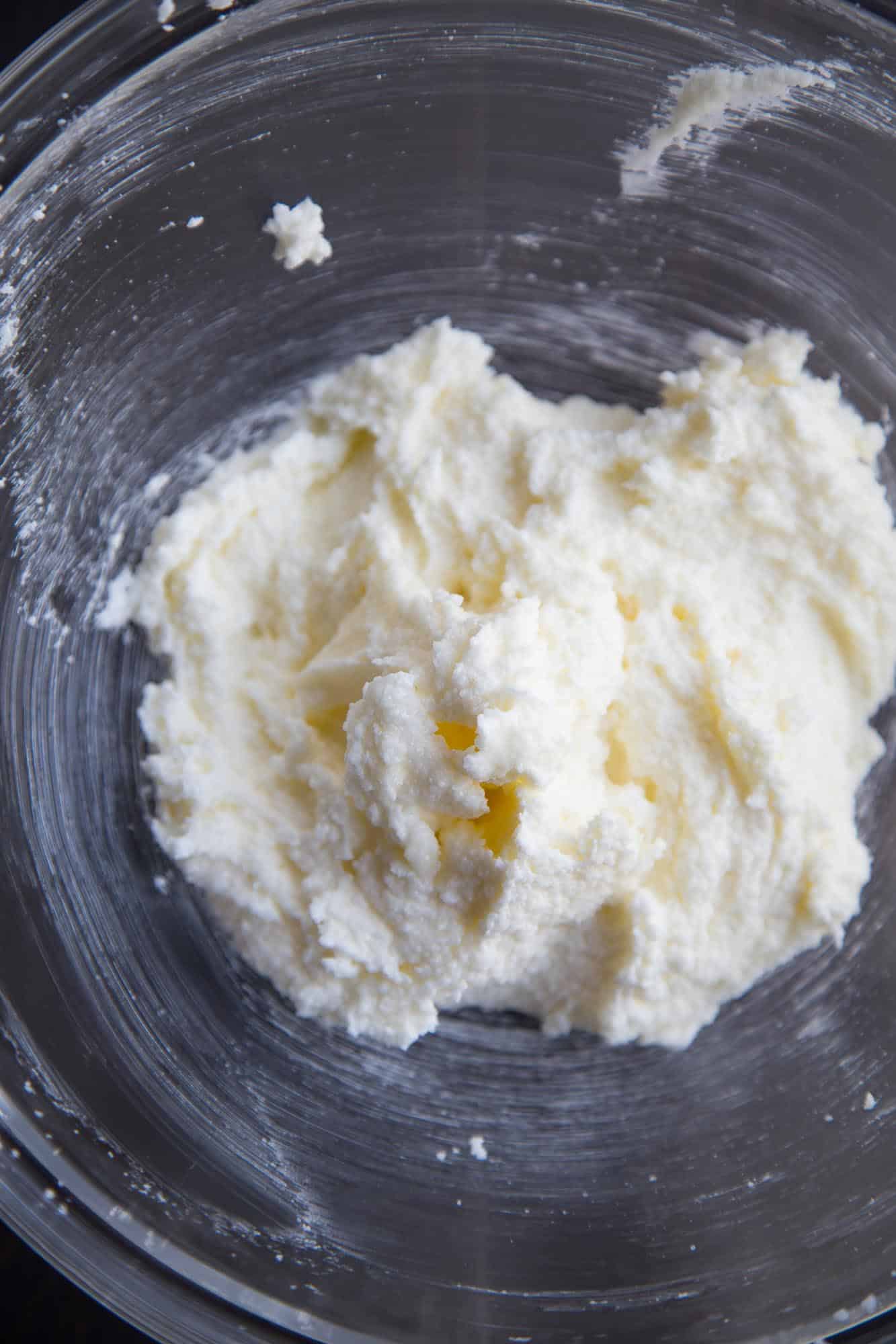 butter and sugar creamed together in a glass bowl