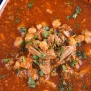 pozole rojo in a large bowl.