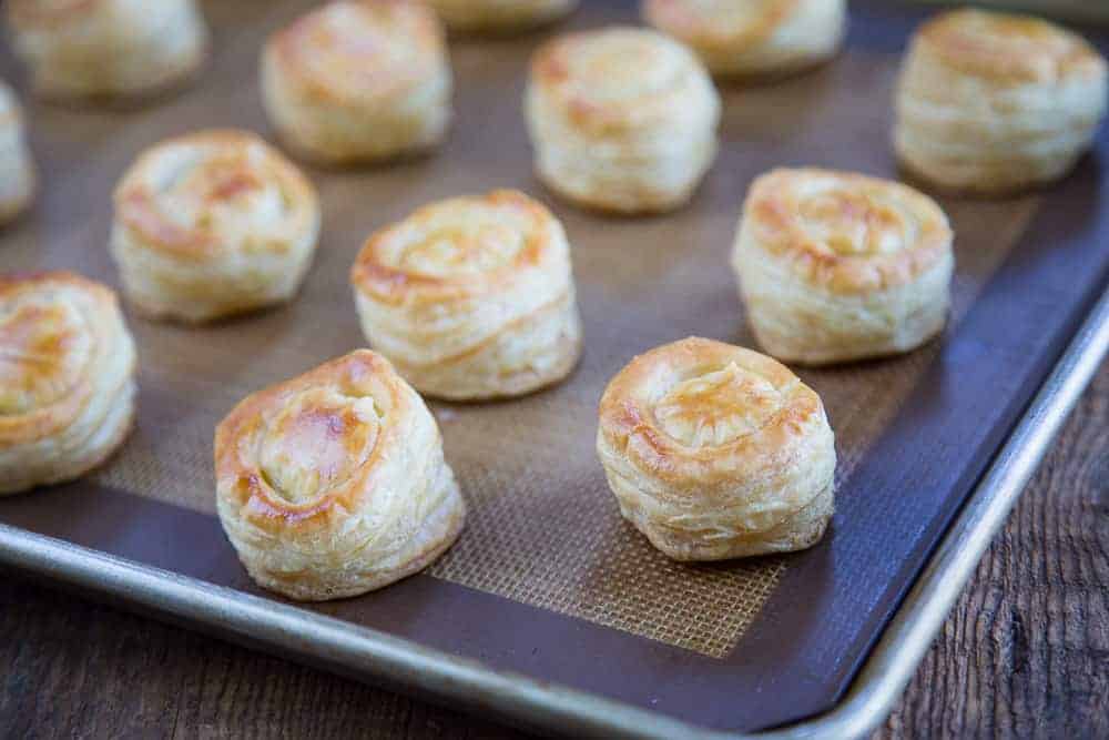 cooked puff pastry cups on a sheet pan