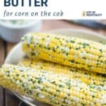 corn on the cob with herb butter in a beige bowl.