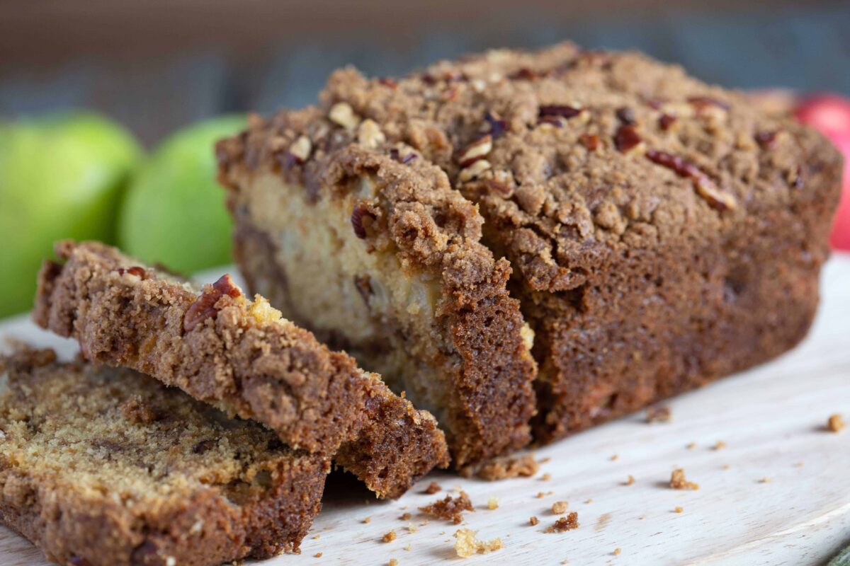 slices of apple bread falling into a wooden board