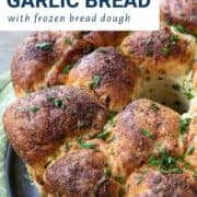 pull apart garlic bread topped with fresh chopped parsley.