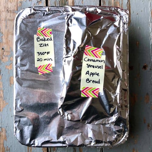 aluminum foil wrapped pans with yellow labels affixed by colorful washi tape.