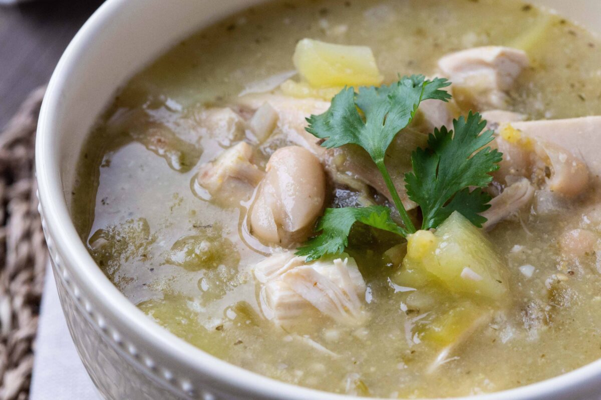 close up view of chicken chili in a yellow bowl