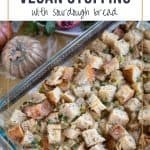 sourdough stuffing in a casserole dish on a thanksgiving table.