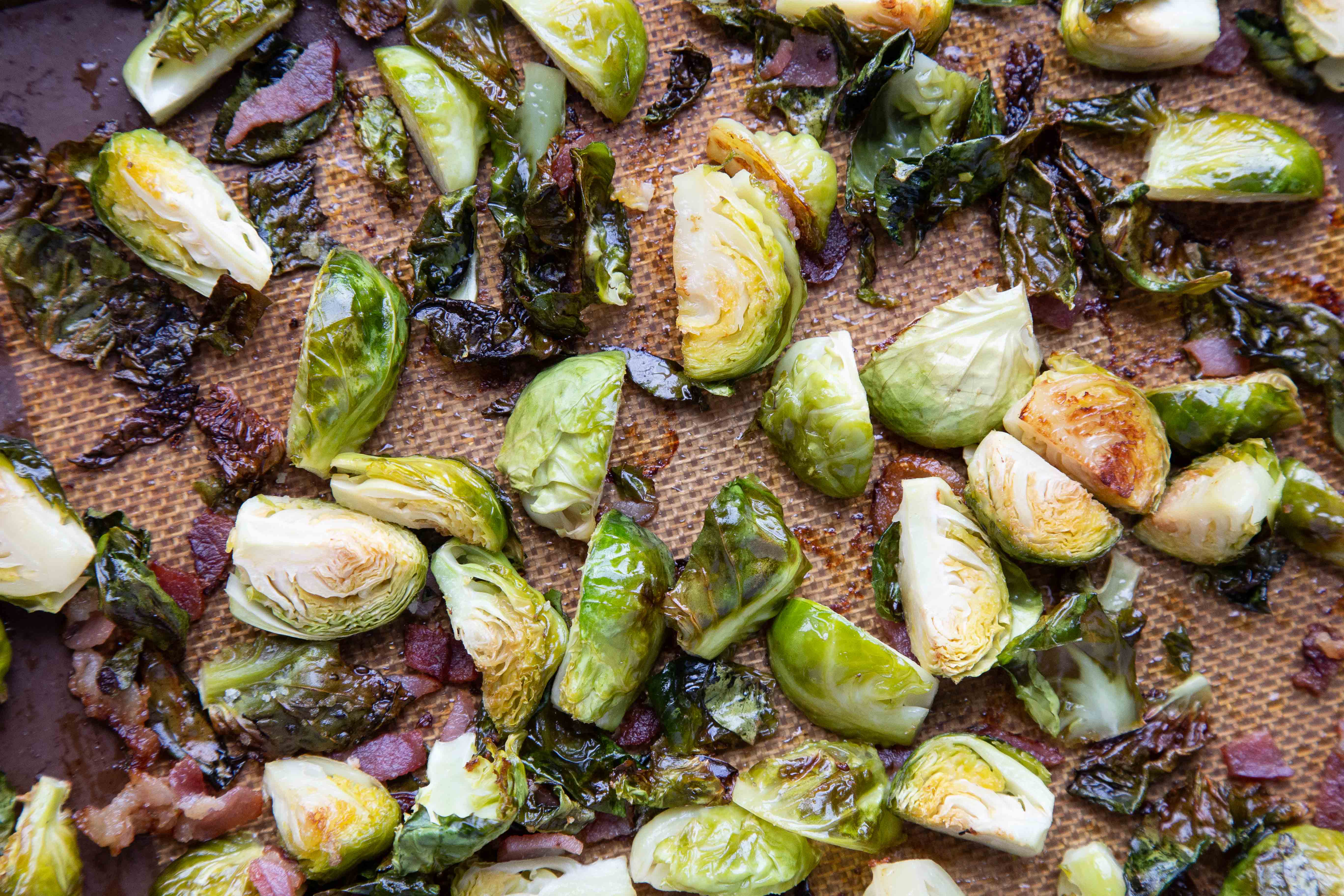 cooked Bacon Brussels Sprouts on a sheet pan.