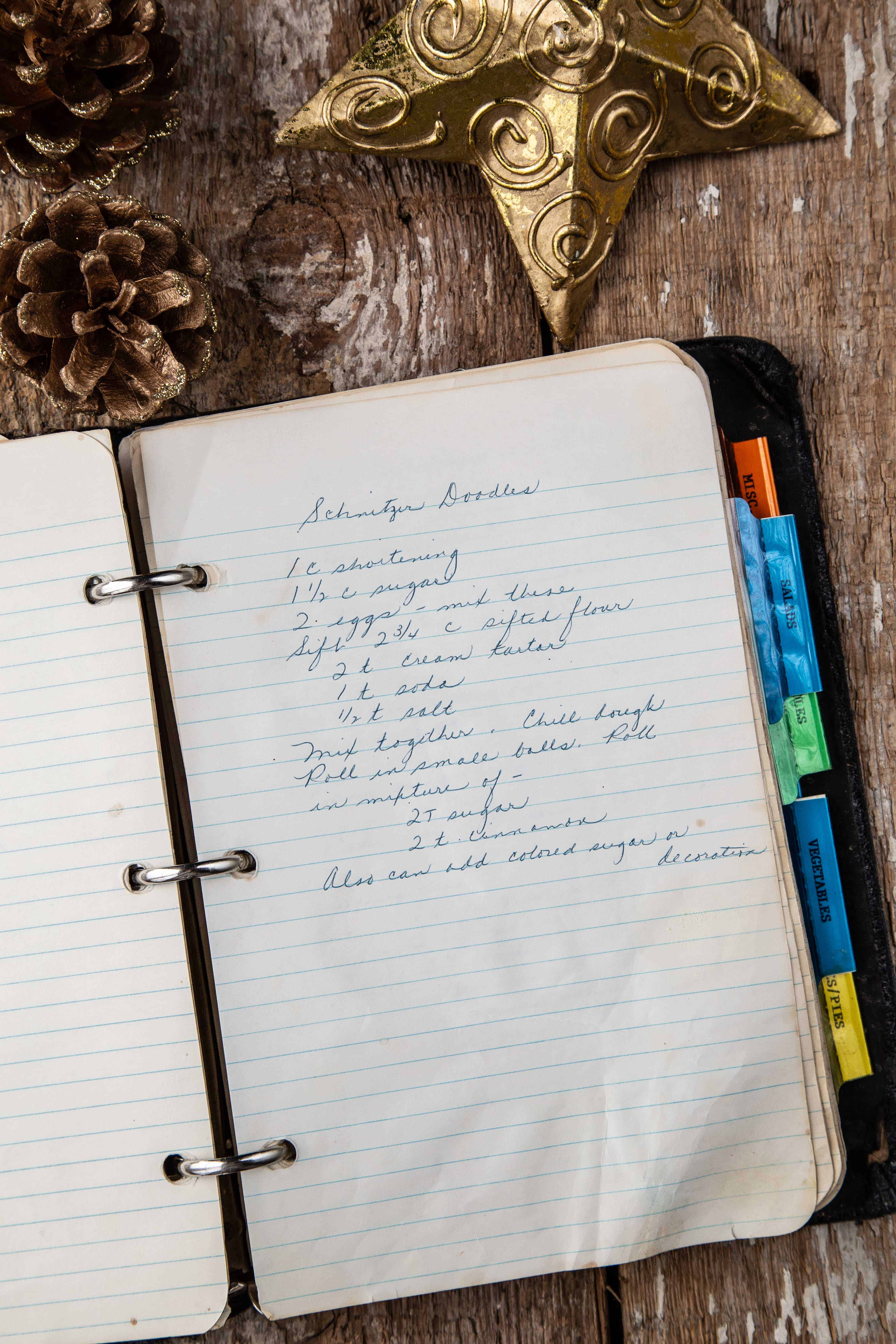 grandma's recipe for snickerdoodles typewritten on a ruled notebook page.