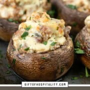 rows of mushrooms stuffed with cheese and sausage.