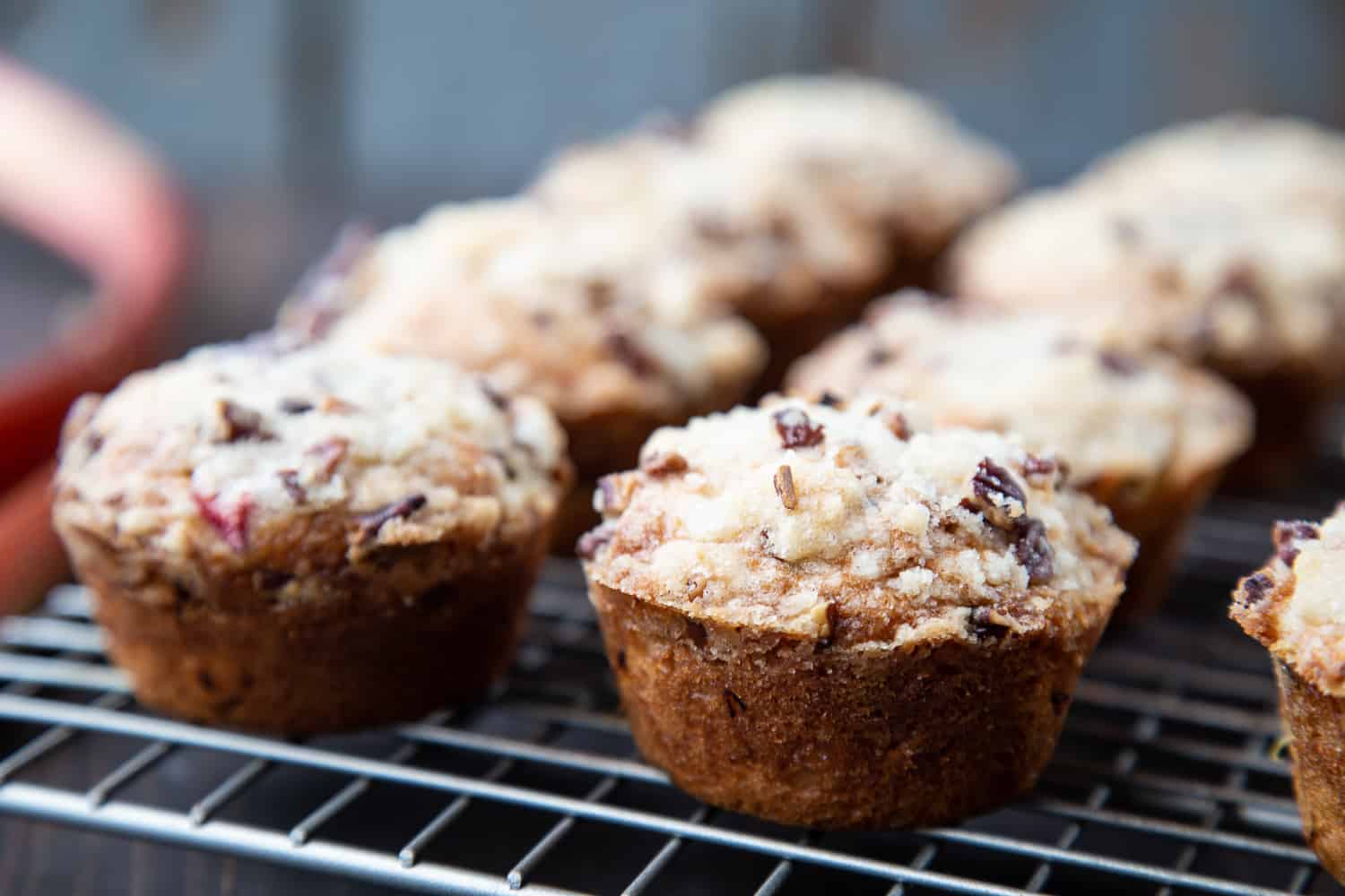 Rhubarb Muffins on a wire cooling rack.