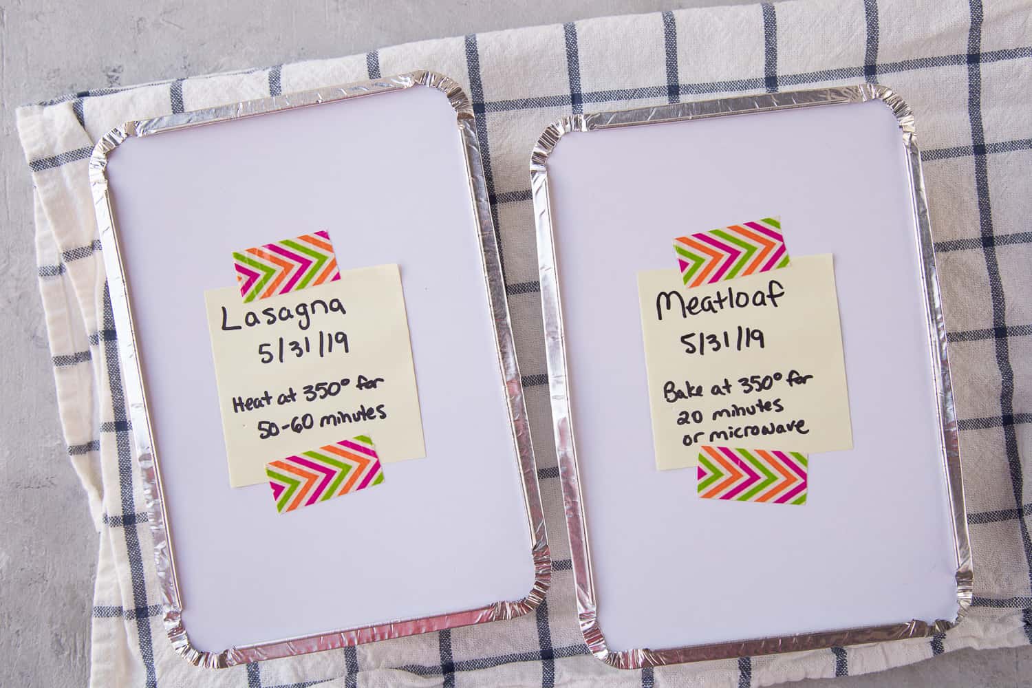 foil pans labeled with contents on post-it notes, taped with colorful washi tape.