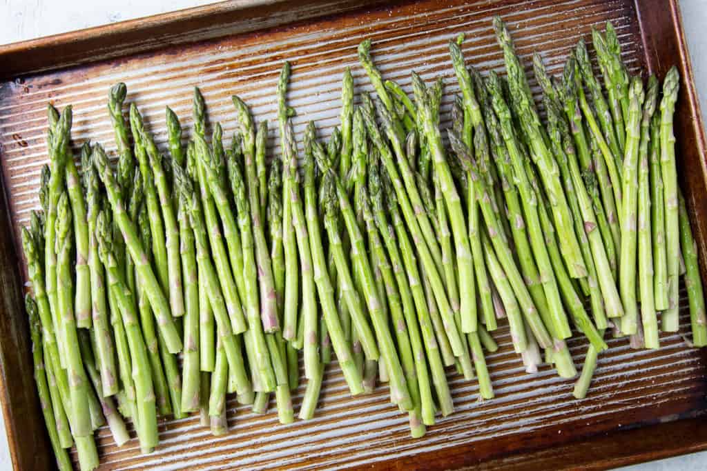 Raw asparagus tossed with olive oil and salt