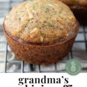 zucchini muffin on a wire rack.