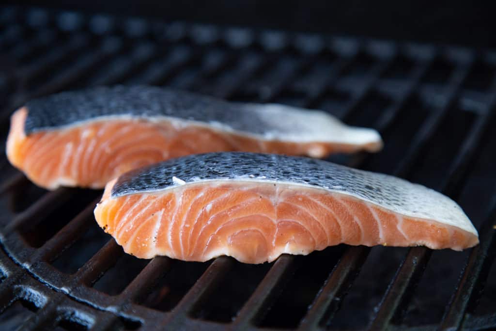 Two salmon fillets on the grill