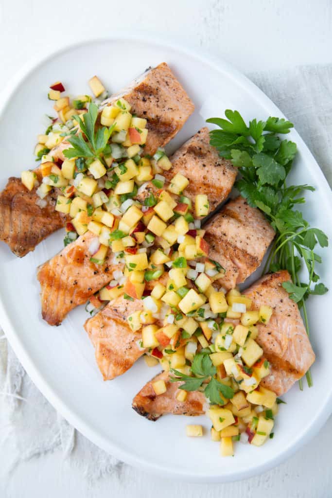 Grilled Salmon with Nectarine Salsa on white platter