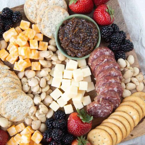 cheese cubes with crackers and jam.