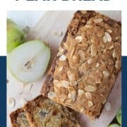 loaf of pear bread on a decorative wooden board.