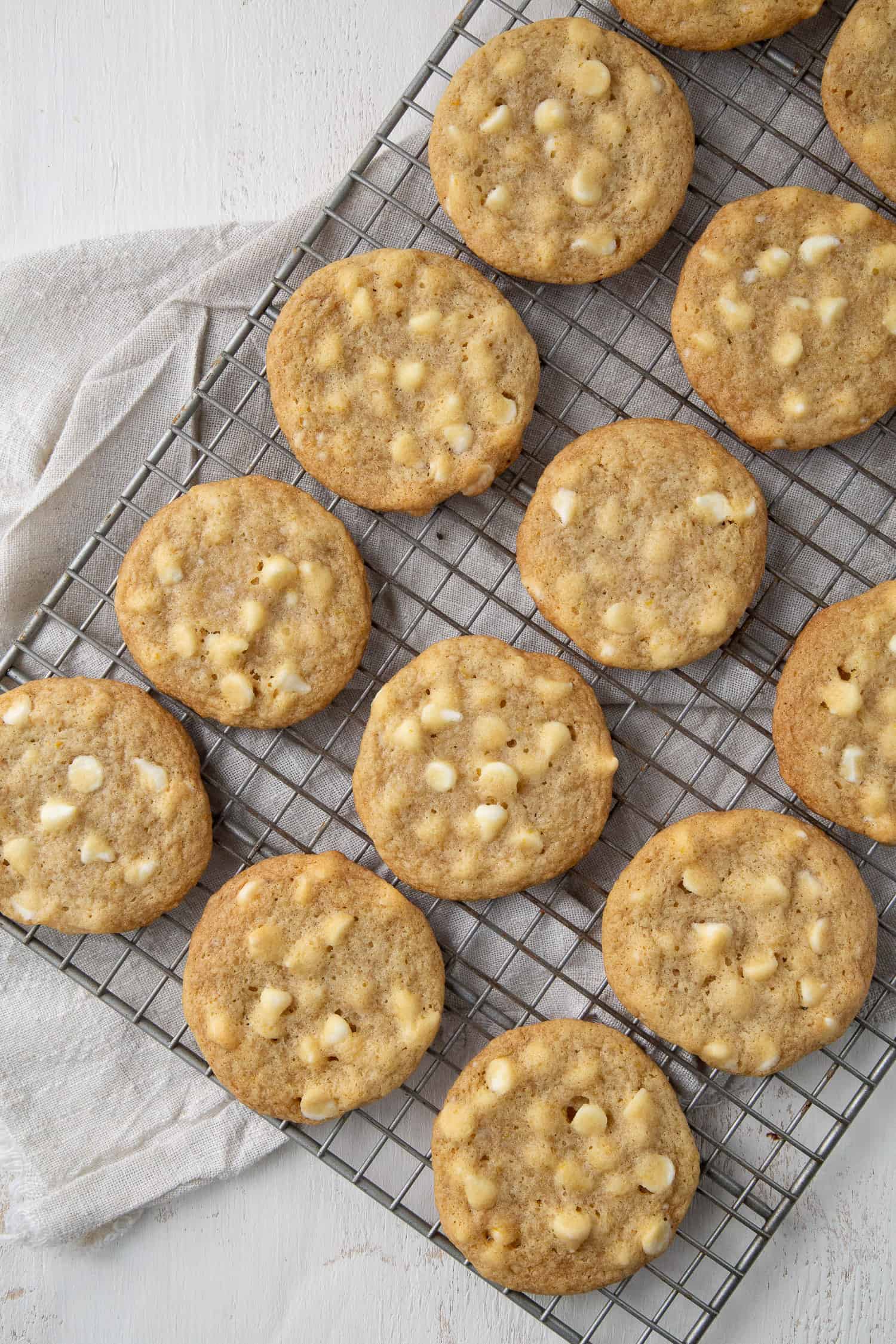 white chocolate cookies on a wire rack.