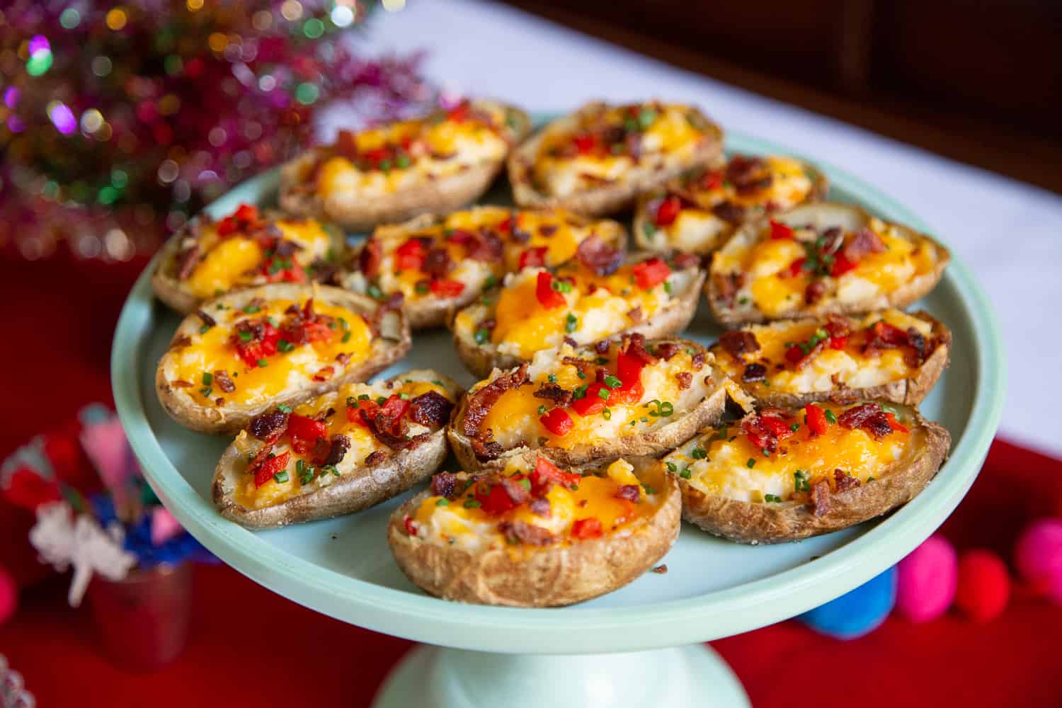 Holiday Potato Skins on a jade green cake stand.