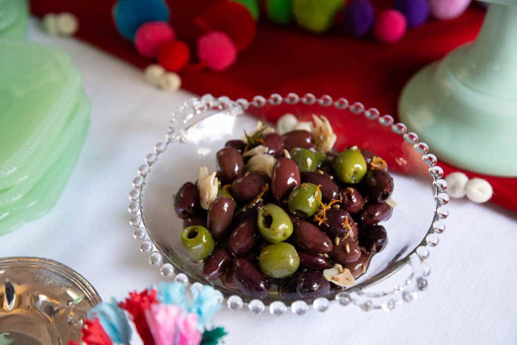 Citrus marinated olives on a buffet table.