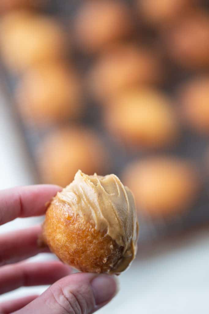 Beignet dipped in honey peanut butter