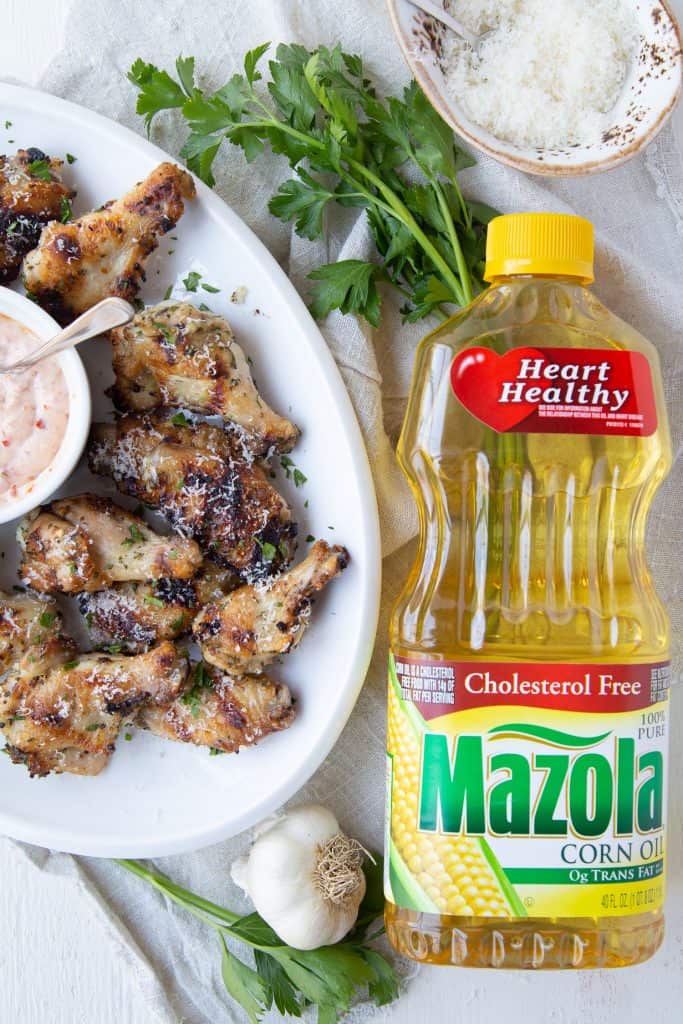Grilled wings with a Mazola corn oil bottle
