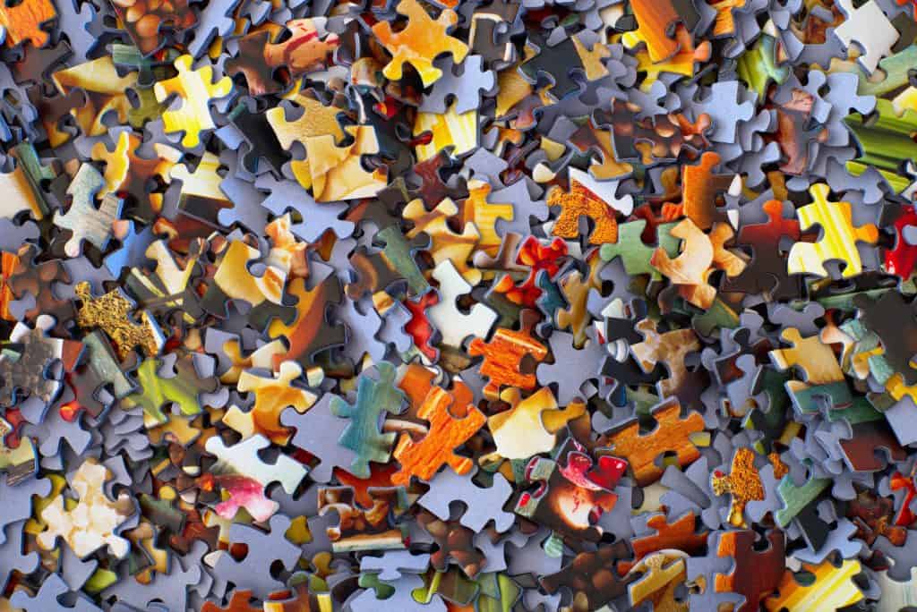 colorful jigsaw puzzle pieces jumbled together