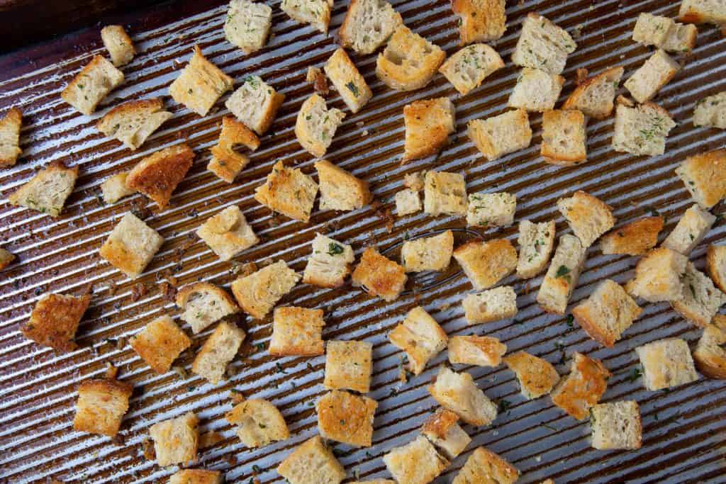 Golden brown croutons on a sheet pan