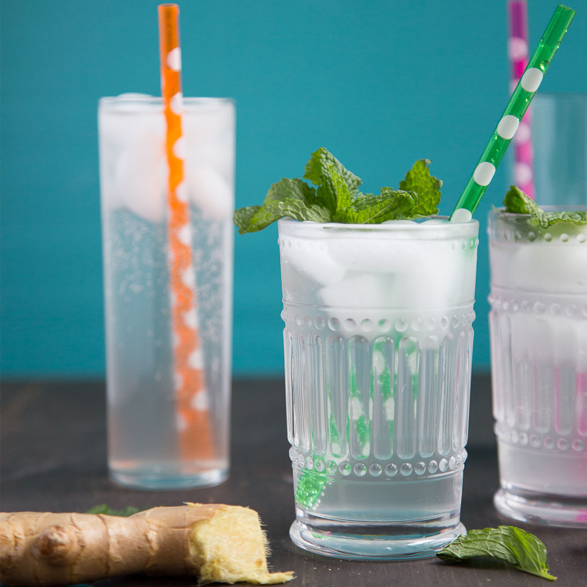 tall glasses of ginger ale with colorful straws