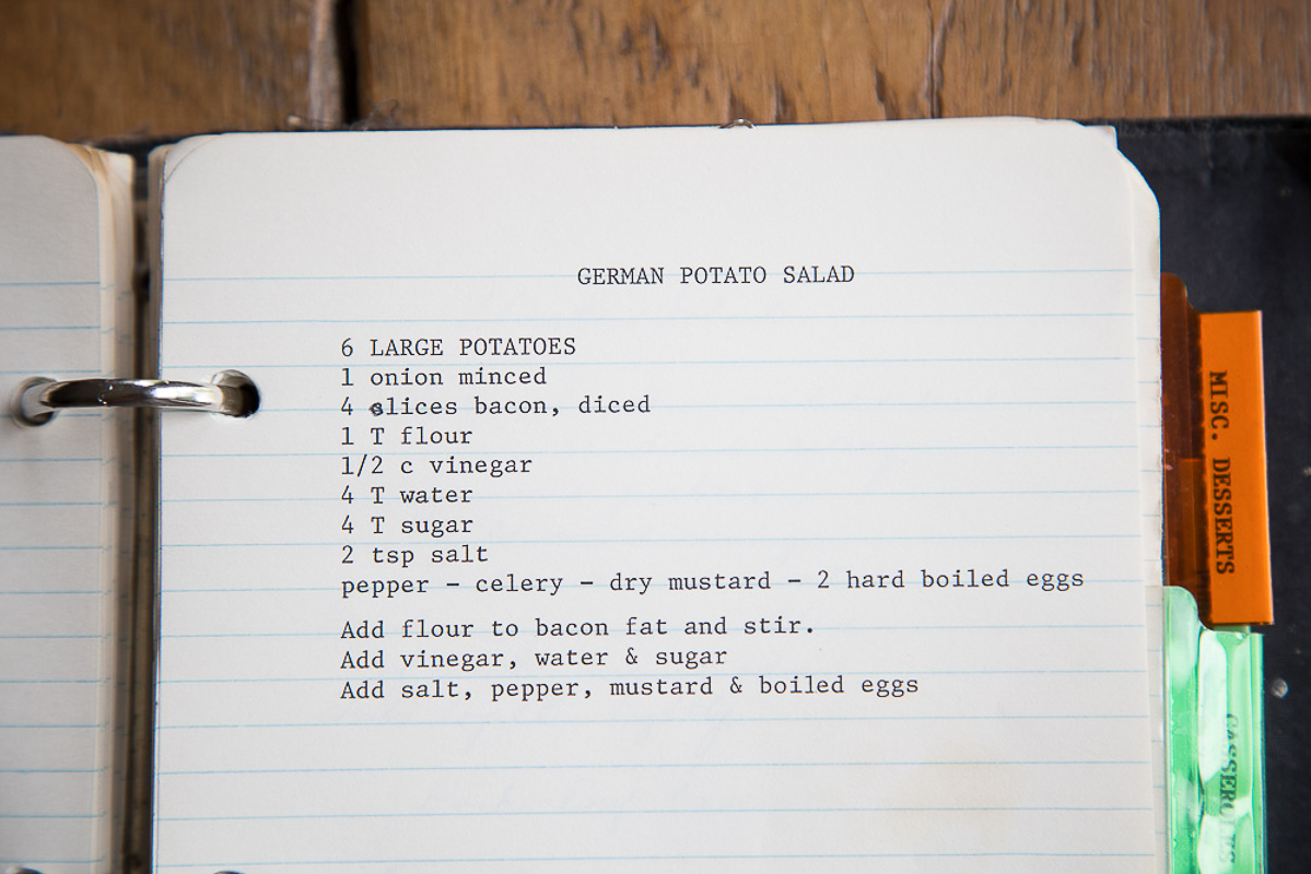 lined notebook paper with a recipe for german potato salad printed using a typewriter