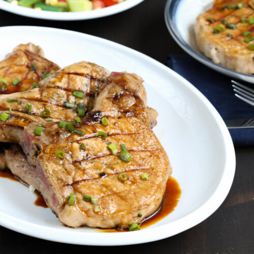 honey soy pork chops on a white platter