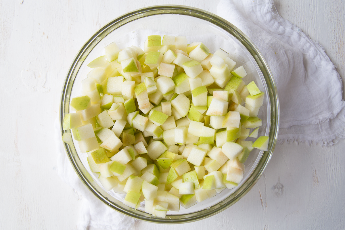 chopped apples in a glass bowl