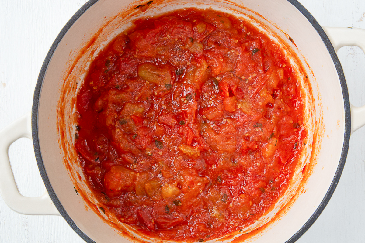 tomato jam in a large white dutch oven