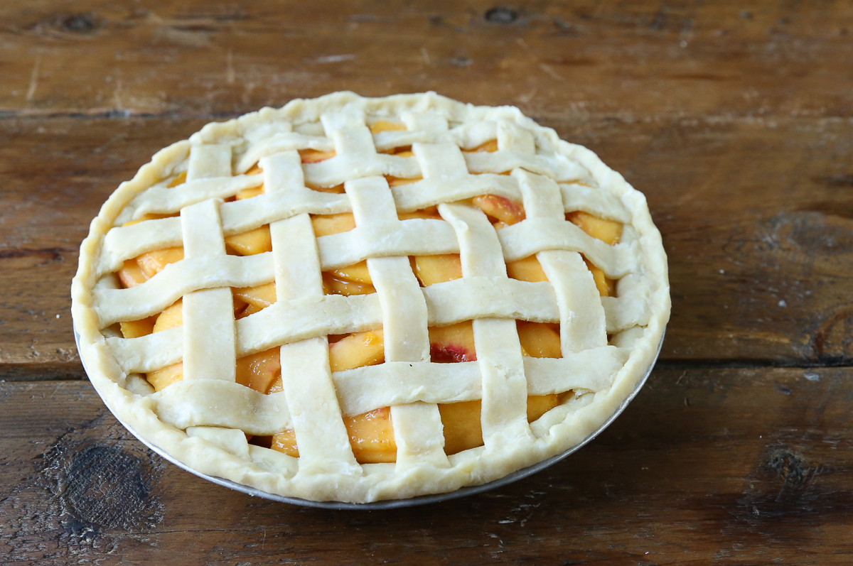 raw peach pie before baking