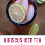 glass of hibiscus tea in a clear glass with a blue rim