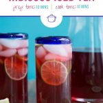 glass of hibiscus tea in a clear glass with a blue rim