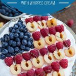 pavlova topped with fresh fruit in a flag design