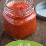 pili pili hot sauce in a glass jar on a wooden table