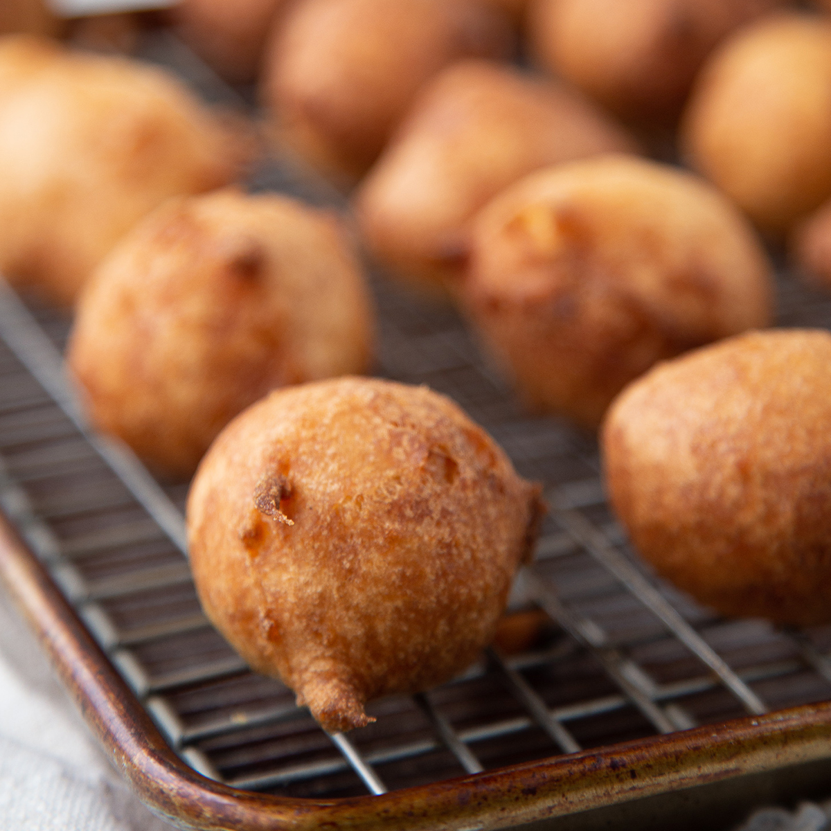 beignets on a wire cooling rack