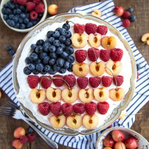 pavlova decorated with fruit in a flag design