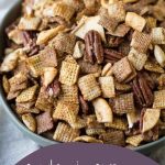 apple cinnamon chex mix in a green bowl on a cream tea towel