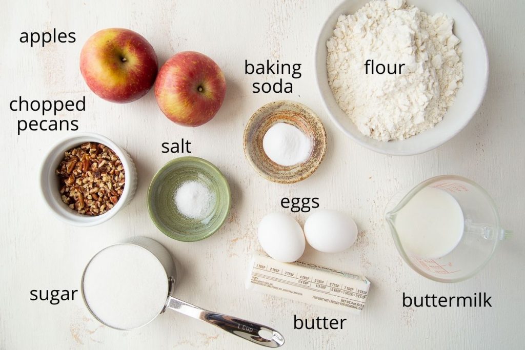 ingredients for apple bread on a white table