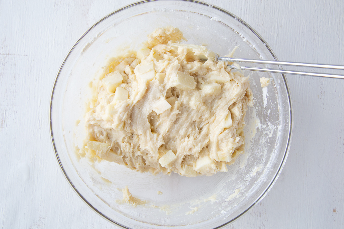 apple bread batter in a bowl with a spatula