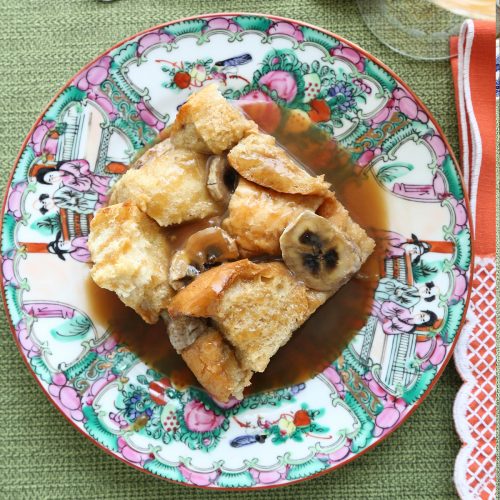 slice of french toast casserole on a colorful china plate