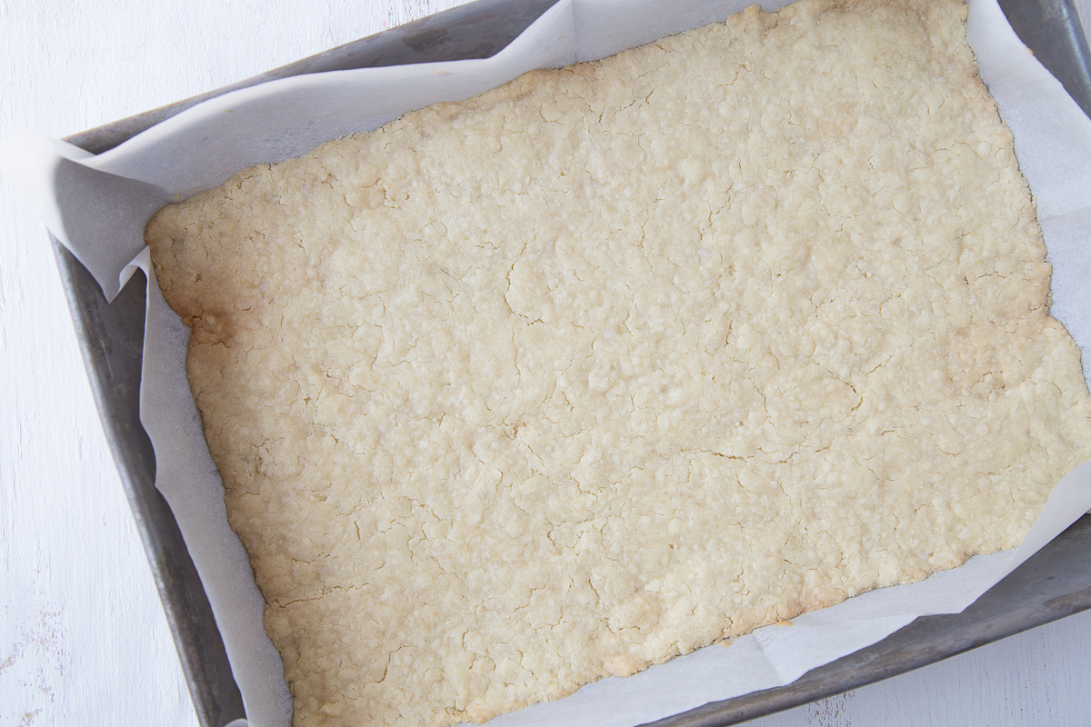 cooked dough spread in a 13x9 inch pan