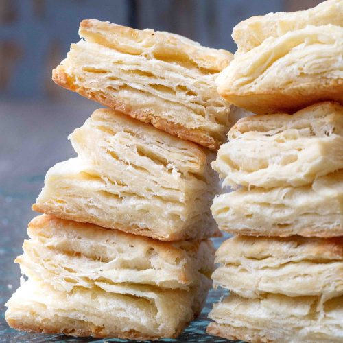 flaky biscuits stacked on top of one another.